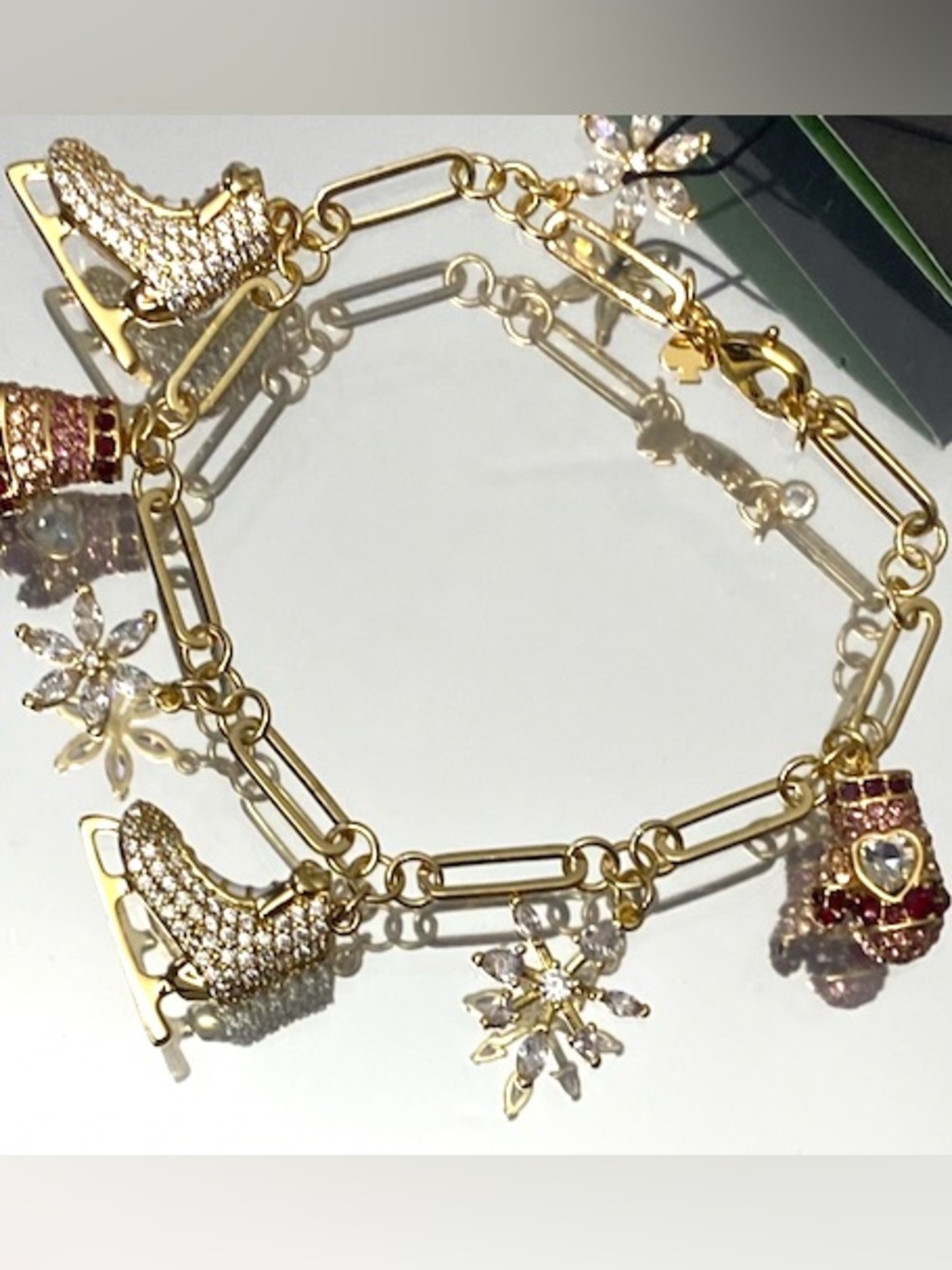 kate spade Gold-Tone Ice Skate & Snowflake Charm Bracelet with Pink Accents - Picture 6 of 9